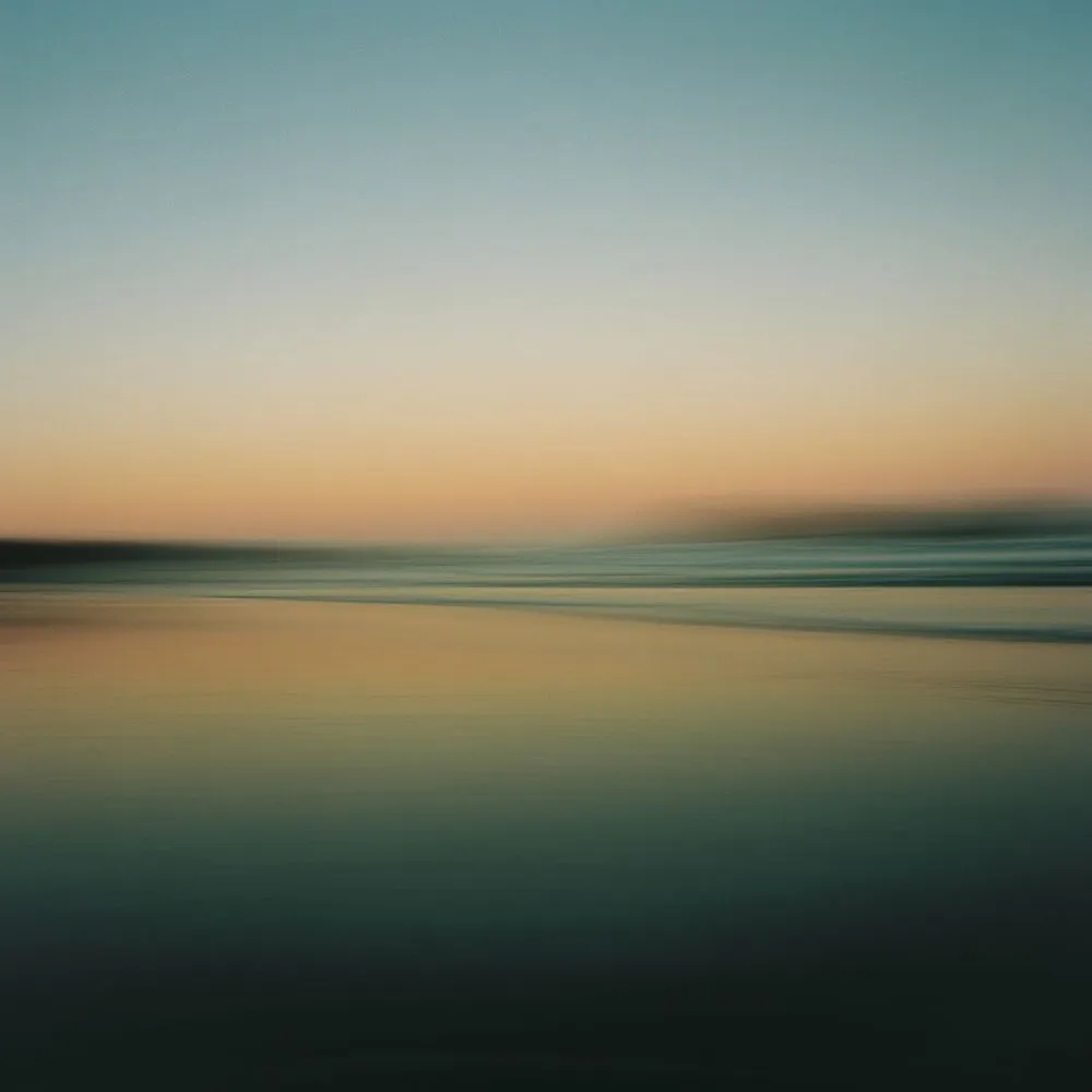 Blurred long exposure of a beach and sea at dusk