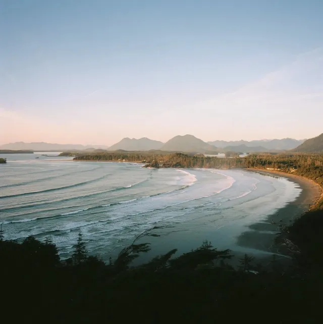 Curving bay with long lines of surf